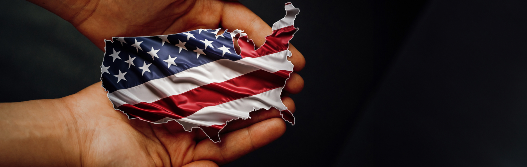 Decorative; USA Flag in the shape of the USA being held in palm of hands