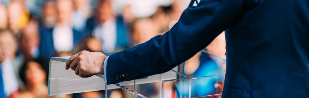 Decorative; (Stock image) Politician (Actor/Model) giving a speech to a crowd.